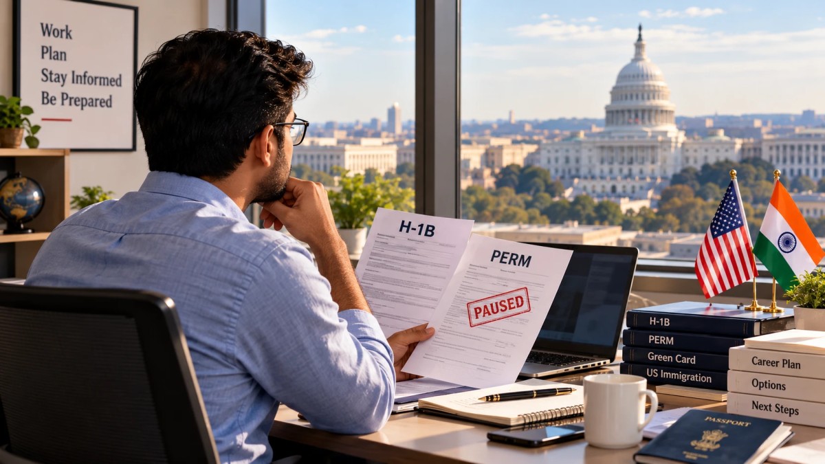 Illustration of an Indian professional reviewing H-1B and PERM documents with a Paused stamp
