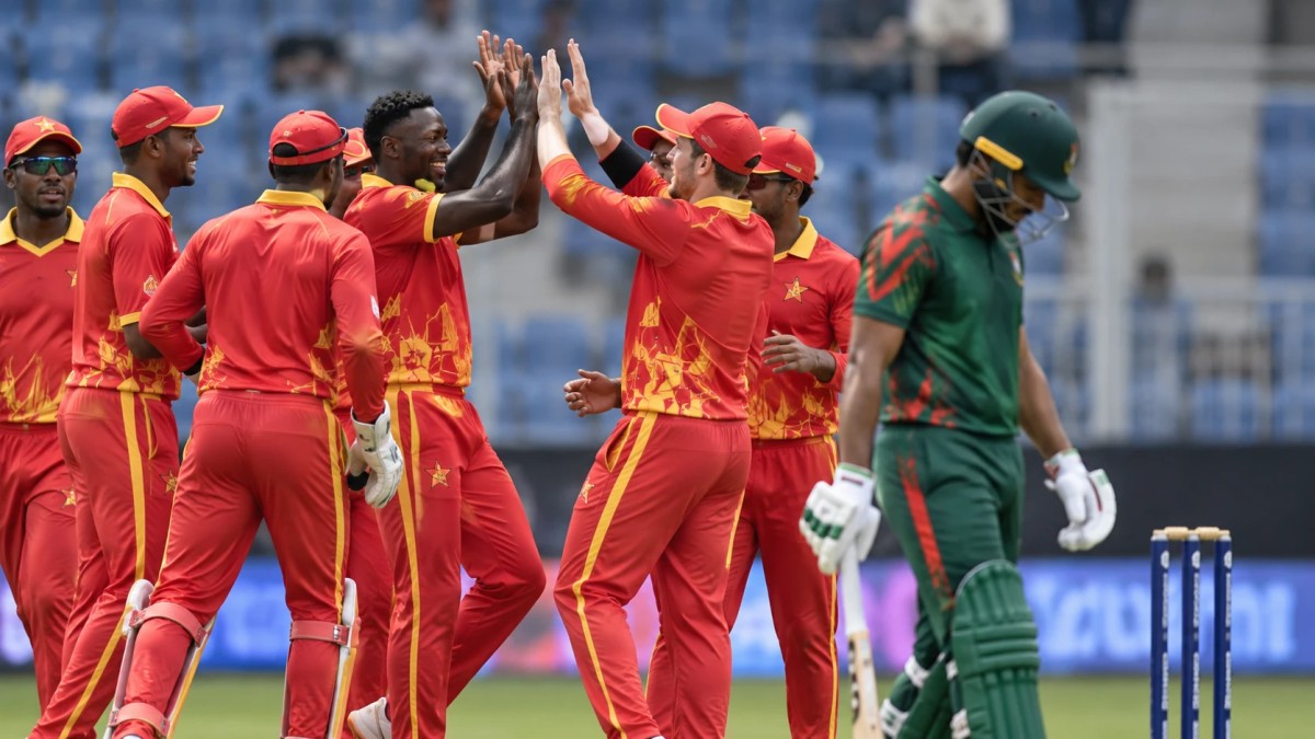 Illustration of cricketers in red and yellow celebrating a wicket as a batter in green walks off