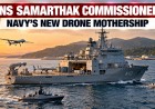 Illustration of a naval drone mothership at sea with a drone overhead and two unmanned boats alongside
