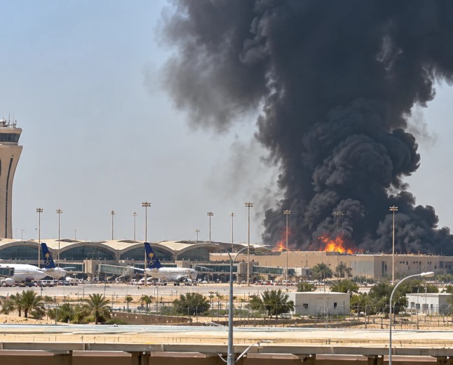 Illustration of smoke rising behind an airport terminal and control tower