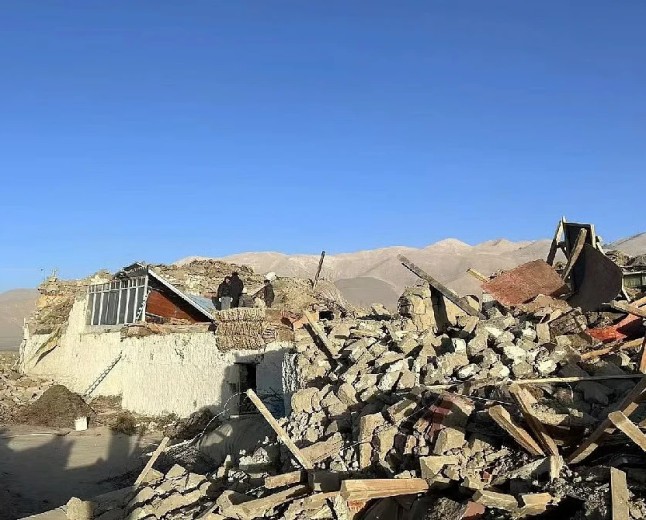 Collapsed stone houses in a mountain village on the Tibetan plateau after an earthquake
